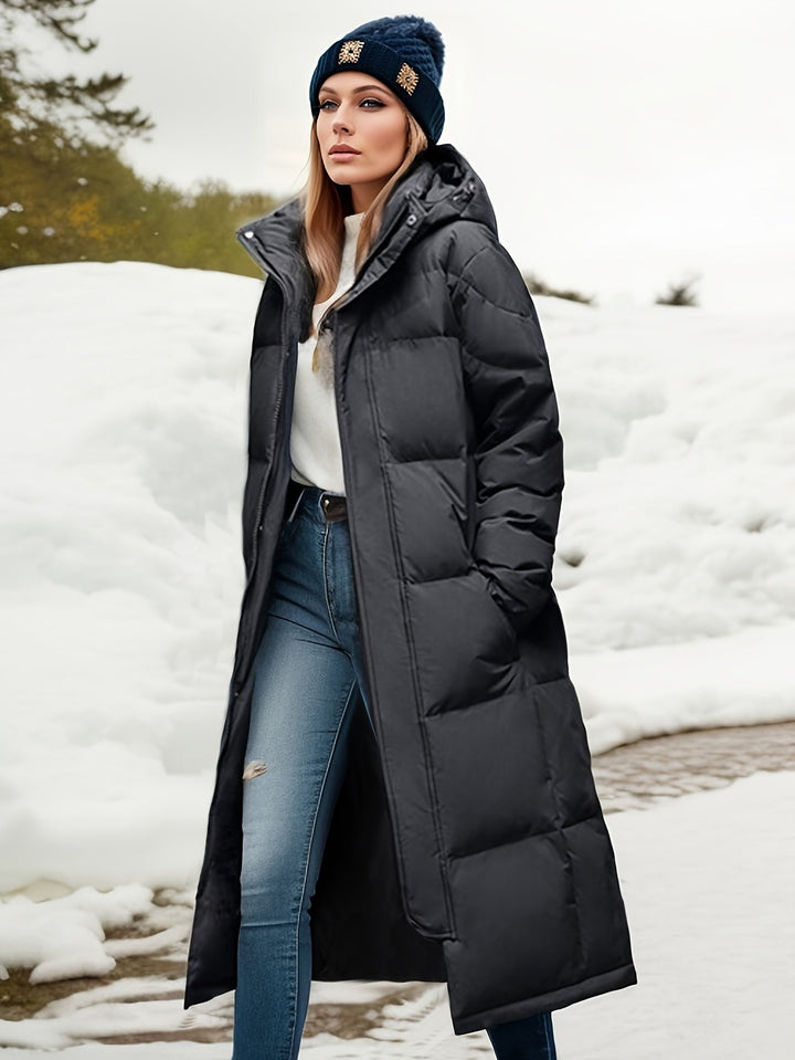 Women's long down coat with hood for autumn/winter; solid pattern, padded for warmth, chic and versatile style.