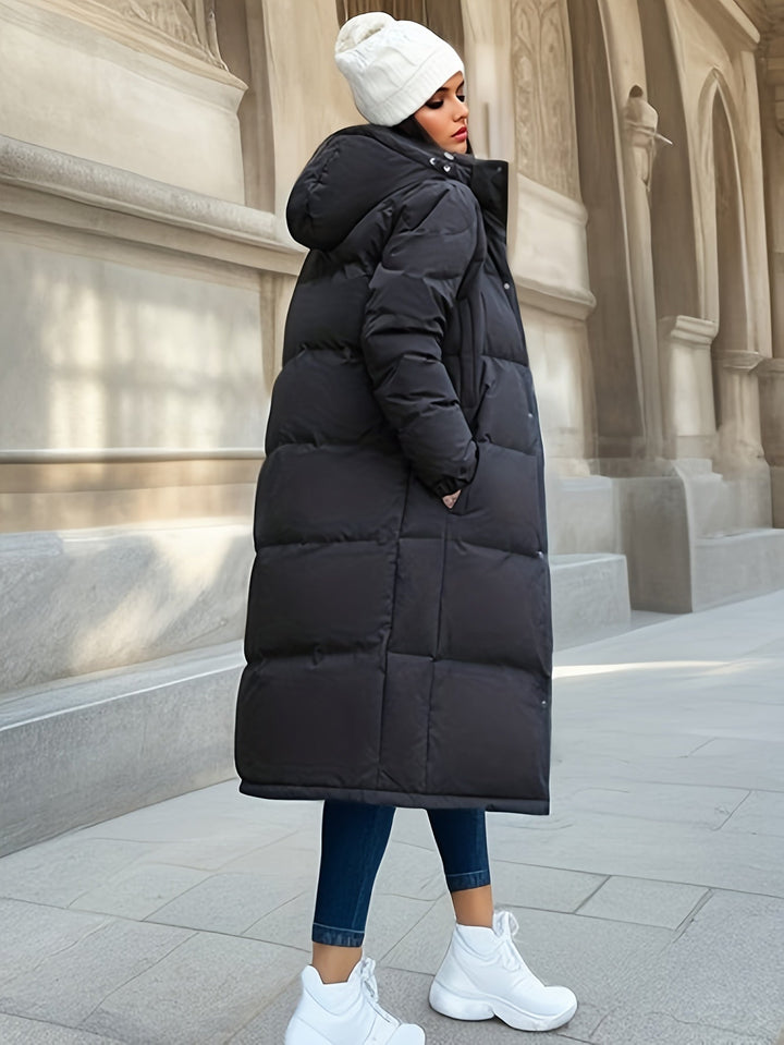 Women's long down coat with hood for autumn/winter; solid pattern, padded for warmth, chic and versatile style.