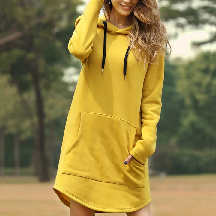 "Women's long style hoodie with relaxed fit, cozy soft fabric, ideal for fall and winter, showcasing trendy casual design."