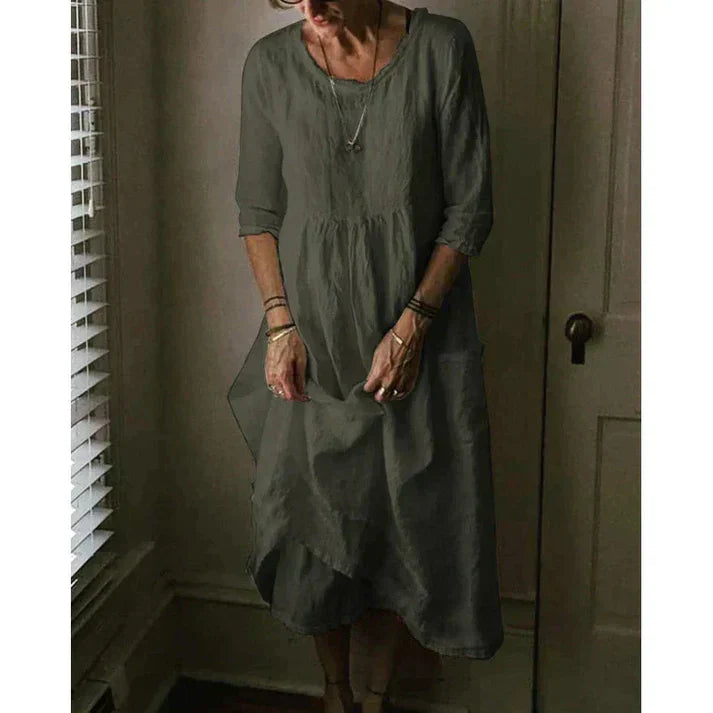 "Women's Loose Fit Cotton Linen Midi Dress with round neck, 3/4 sleeves, asymmetric hem, and pockets in various colors."