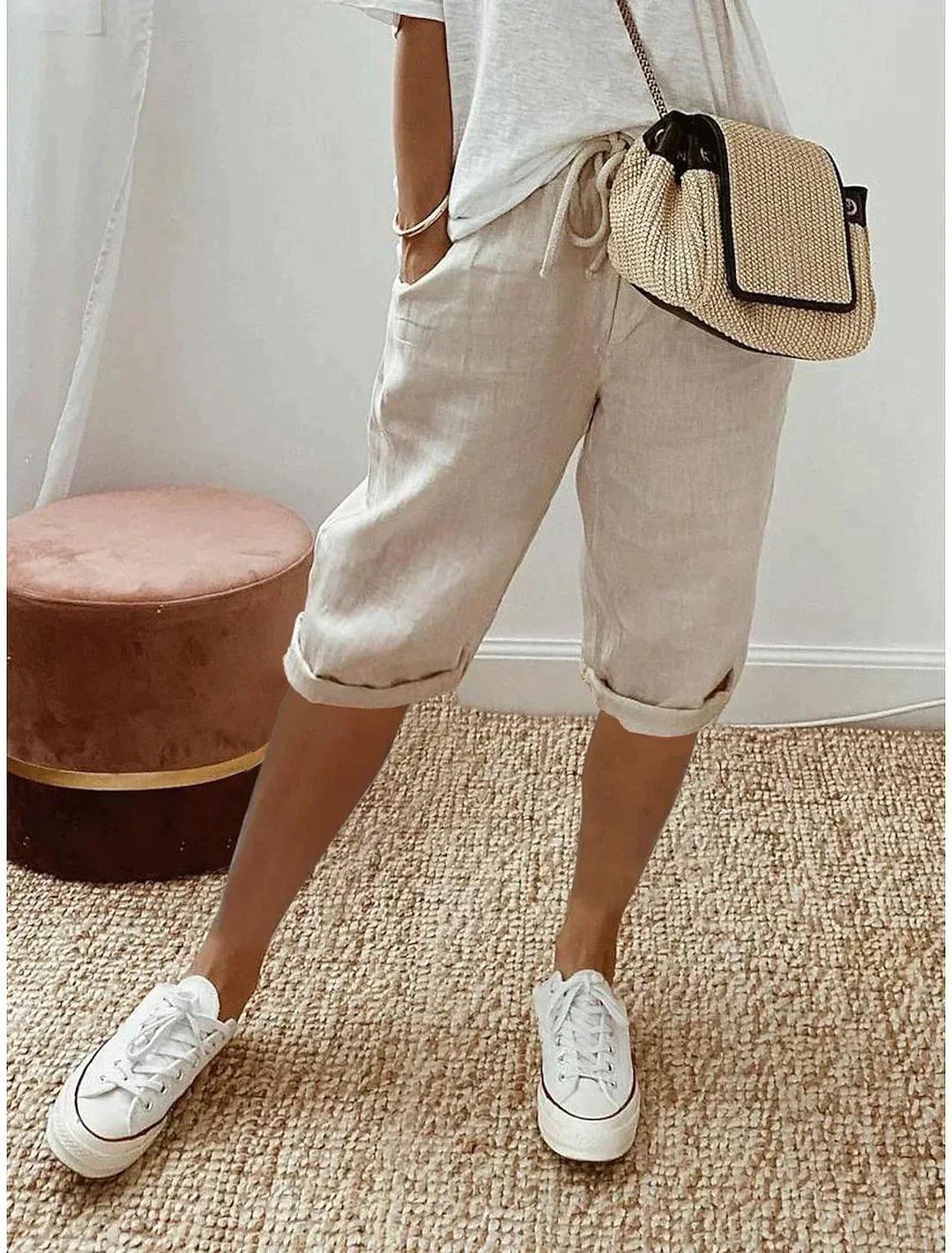 Women's loose-fit linen capri pants, front view showcasing breezy, relaxed design for casual summer style and comfort.