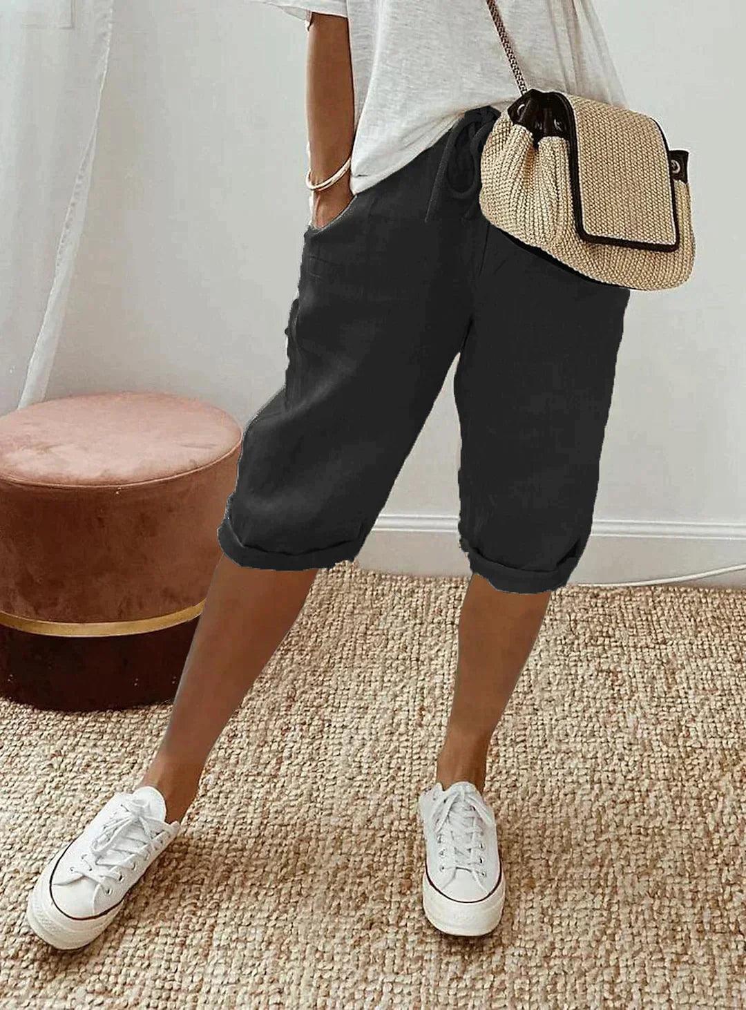 Women's loose-fit linen capri pants, front view showcasing breezy, relaxed design for casual summer style and comfort.