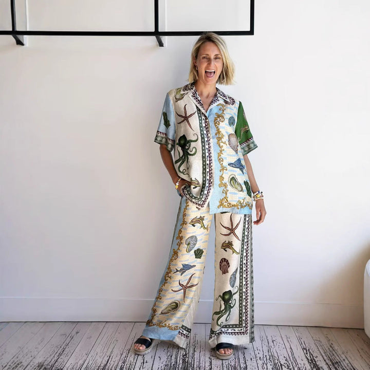 Women's marine print linen blend set with a relaxed shirt and wide-leg pants, ideal for casual or beach occasions.