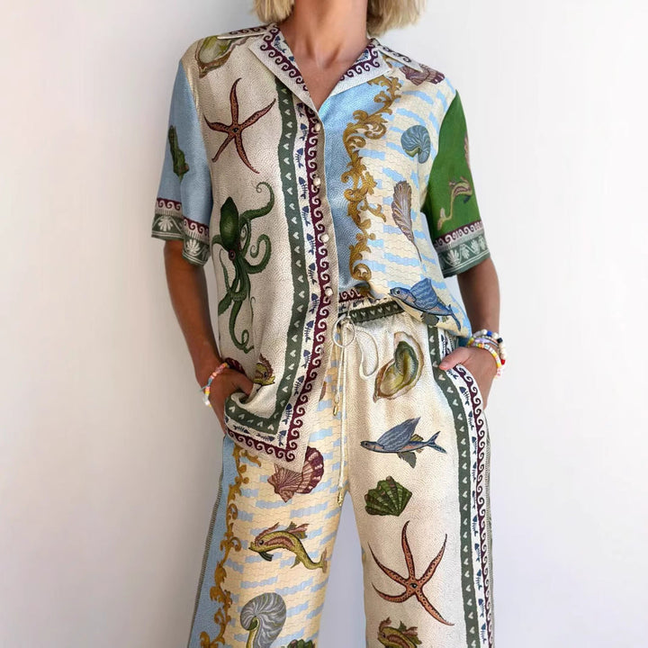 Women's marine print linen blend set with a relaxed shirt and wide-leg pants, ideal for casual or beach occasions.