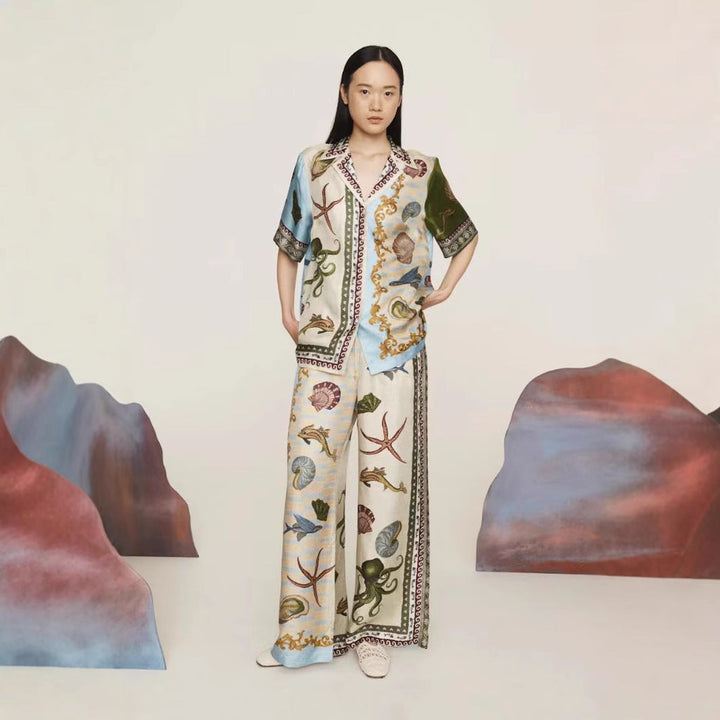 Women's marine print linen blend set with a relaxed shirt and wide-leg pants, ideal for casual or beach occasions.