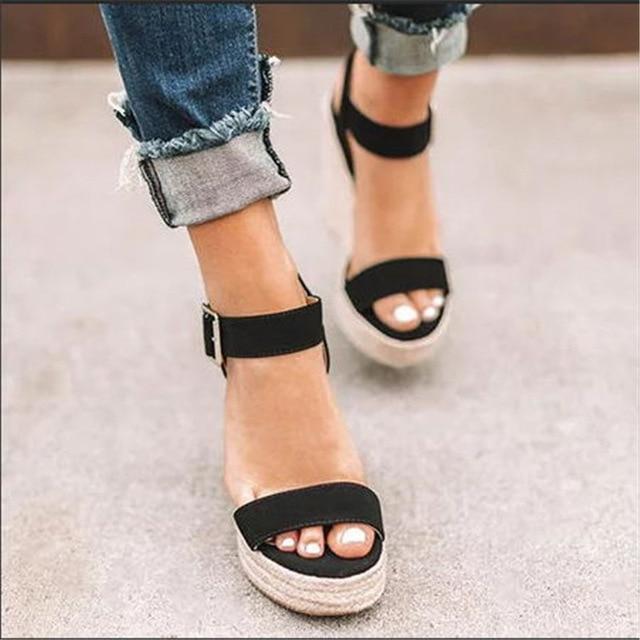 Women's open-toe ankle strap wedge sandals, chic design, versatile summer footwear, day-to-night elegance and comfort.