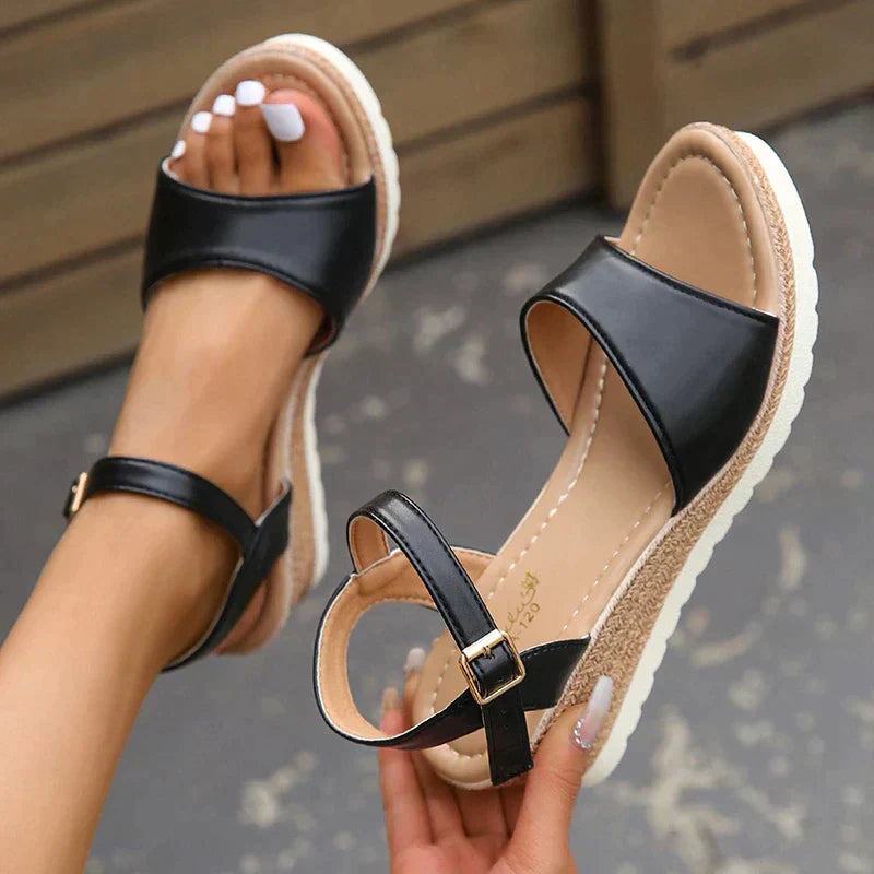 Women's open toe ankle strap wedge sandals with comfort sole; chic wedge heel and adjustable strap for summer style.