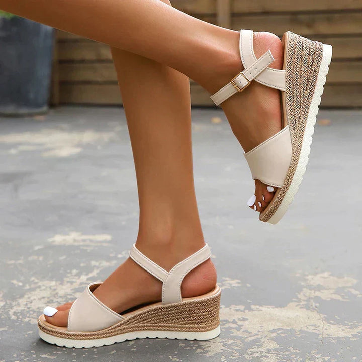 Women's open toe ankle strap wedge sandals with comfort sole; chic wedge heel and adjustable strap for summer style.