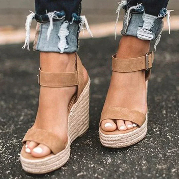 "Women's open-toe espadrille wedge sandals with ankle strap, faux leather upper, and woven wedge, ideal for summer style."