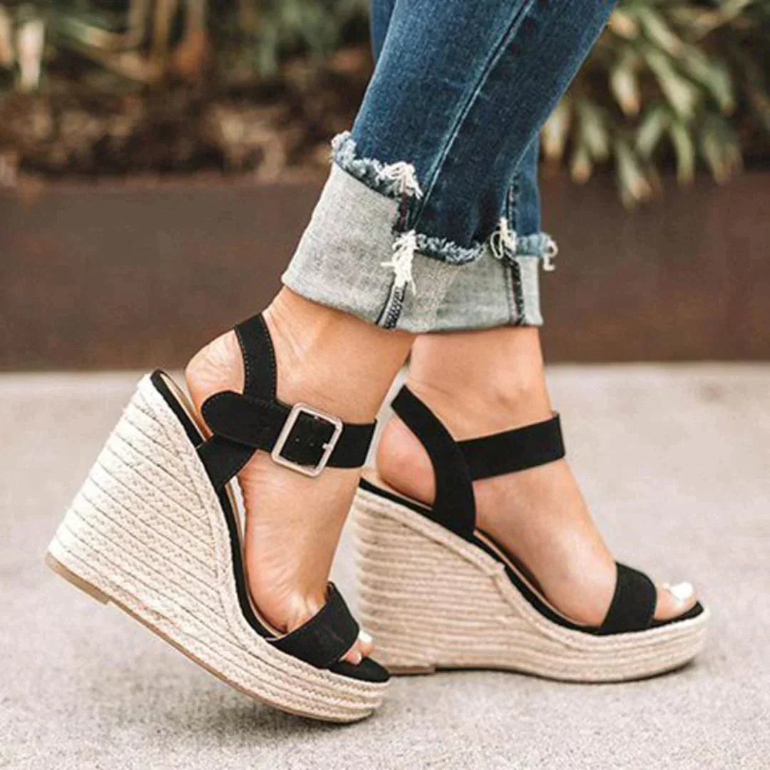 "Women's open-toe espadrille wedge sandals with ankle strap, faux leather upper, and woven wedge, ideal for summer style."