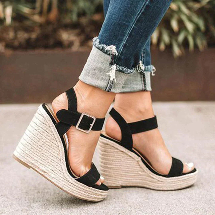 "Women's open-toe espadrille wedge sandals with ankle strap, faux leather upper, and woven wedge, ideal for summer style."