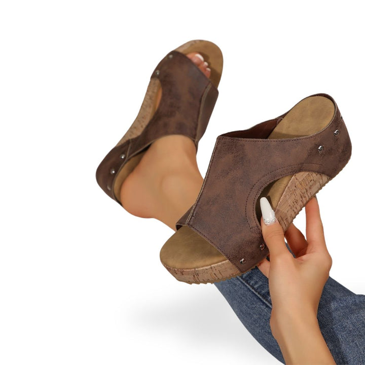 "Women's orthopedic cork wedge sandals in black with open-toe, breathable material, and supportive footbed."