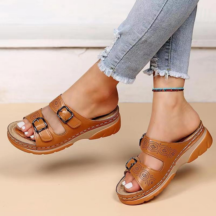 Women's orthopedic sandals with cushioned insole, open-toe design, brown color, adjustable straps for ergonomic support.