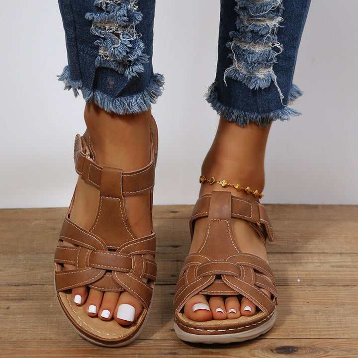 "Women's orthopedic sandals with Velcro straps, faux leather, cushioned footbed, and rubber sole for comfort and style."