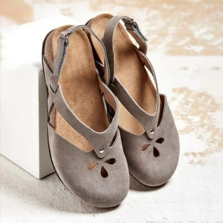 Women's orthopedic slingback sandals with ergonomic insole, cross-strap, and closed toe for style and comfort.