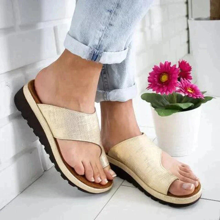 Women's orthopedic slip-on sandals with toe-support, brown color, featuring cushioned soles and toe-alignment design.