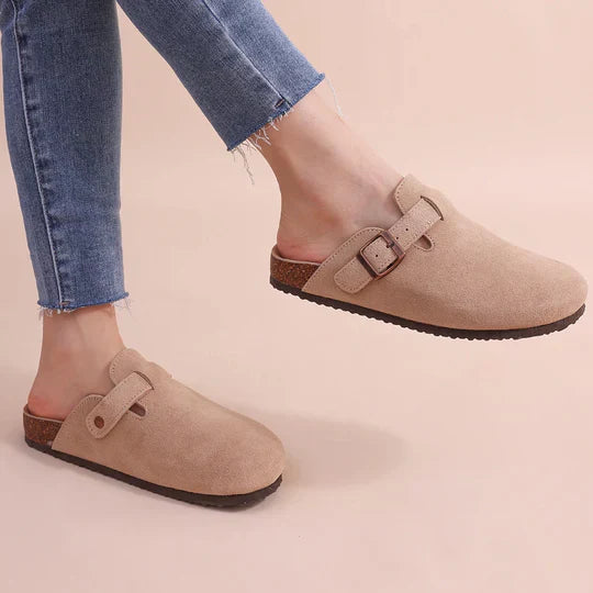 Women's orthopedic suede cork footbed slippers with adjustable straps, shown in beige, offering comfort and style.