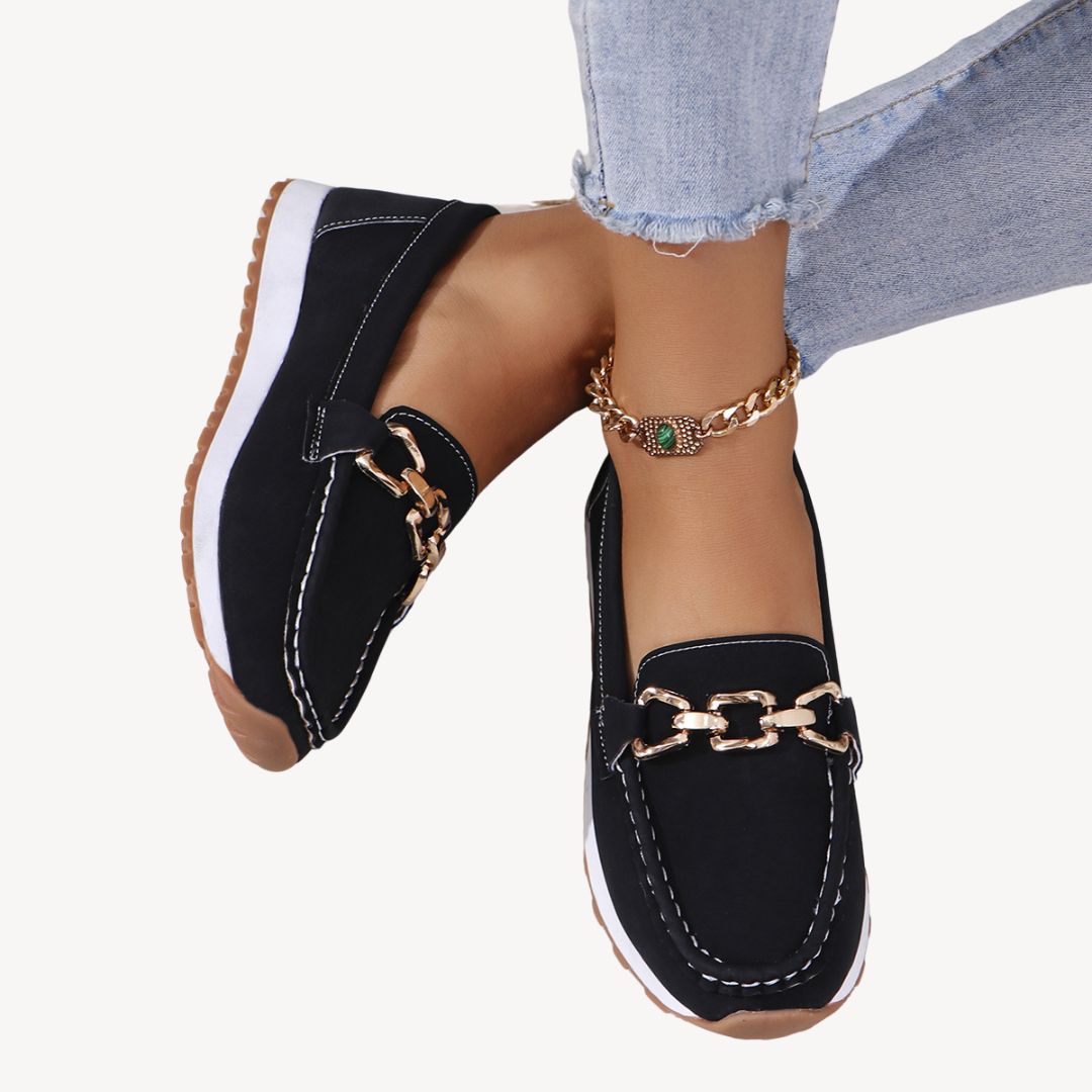 "Women's orthopedic suede loafers with gold chain detail, soft suede, and slip-on design for style and comfort."