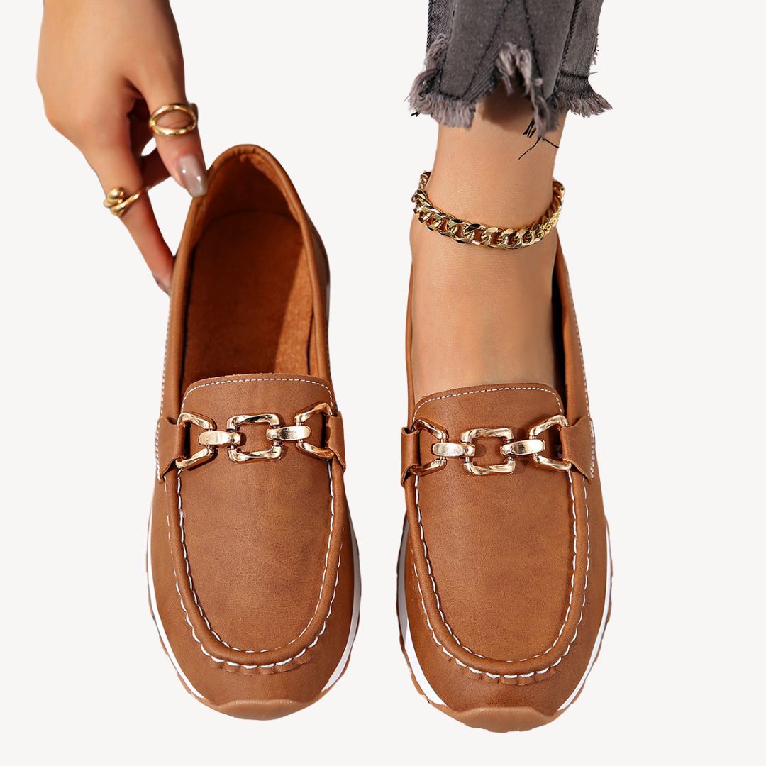 "Women's orthopedic suede loafers with gold chain detail, soft suede, and slip-on design for style and comfort."
