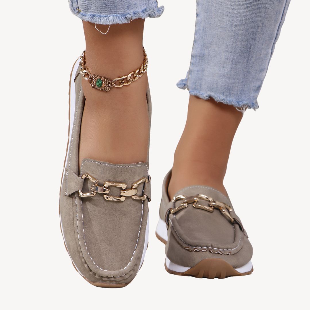 "Women's orthopedic suede loafers with gold chain detail, soft suede, and slip-on design for style and comfort."
