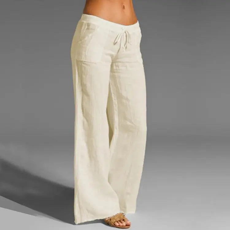 "Women's relaxed linen trousers with elastic waistband, featuring a loose fit and breathable material for summer comfort."
