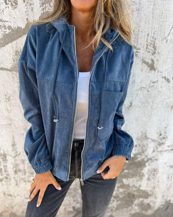 "Women's retro corduroy zip jacket with hood, showcasing vintage style with its textured fabric and practical zip closure."