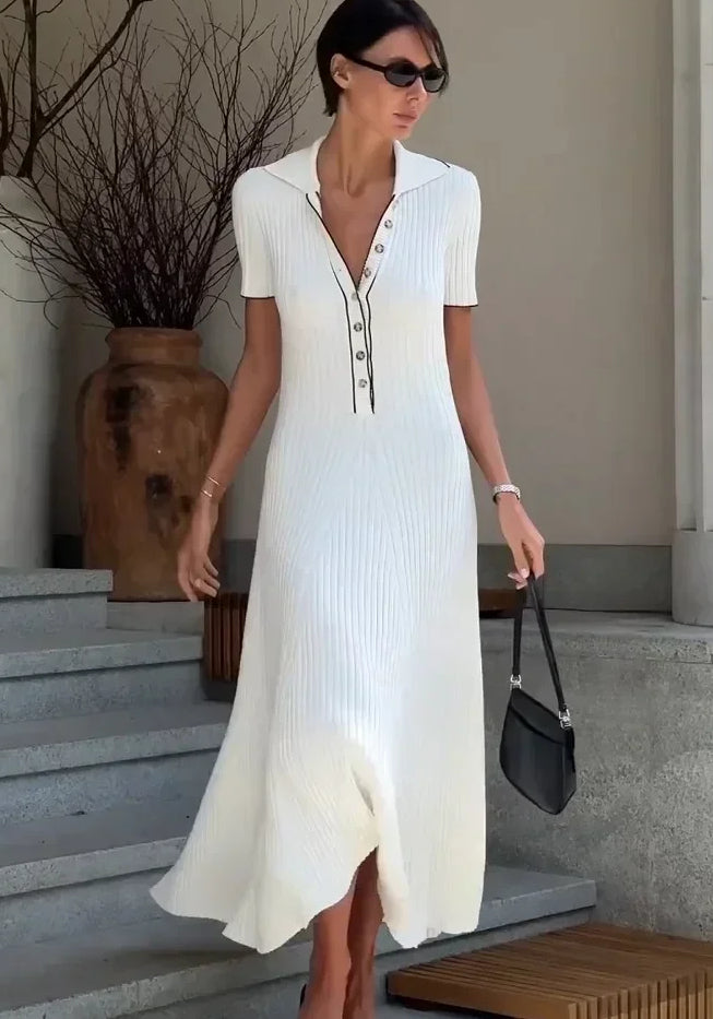 "Women's ribbed knit maxi dress with collared V-neck, button details, and flowing silhouette in versatile colors."