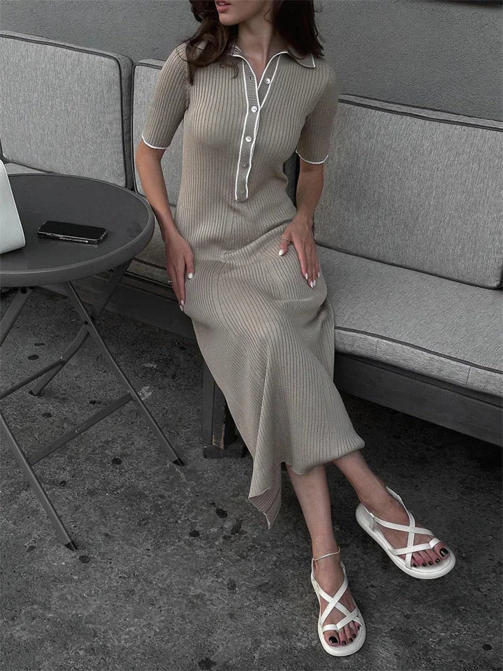 "Women's ribbed knit maxi dress with collared V-neck, button details, and flowing silhouette in versatile colors."