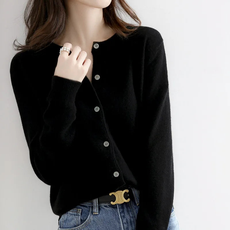 Women's soft cashmere button-up cardigan, classic design, long sleeves, versatile for casual and formal outfits.