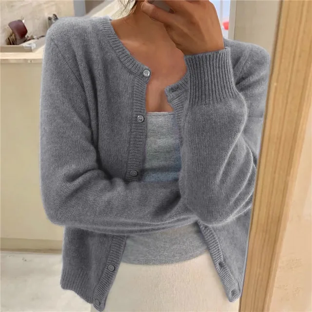 Women's solid color knit cardigan, soft breathable fabric, stylish minimalist design, versatile wardrobe essential.