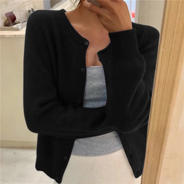 Women's solid color knit cardigan, soft breathable fabric, stylish minimalist design, versatile wardrobe essential.