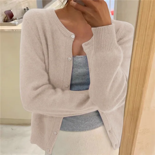 Women's solid color knit cardigan, soft breathable fabric, stylish minimalist design, versatile wardrobe essential.