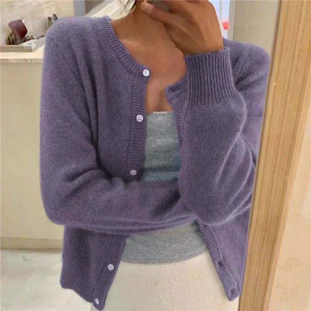 Women's solid color knit cardigan, soft breathable fabric, stylish minimalist design, versatile wardrobe essential.