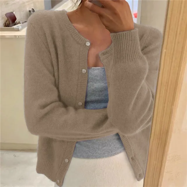 Women's solid color knit cardigan, soft breathable fabric, stylish minimalist design, versatile wardrobe essential.