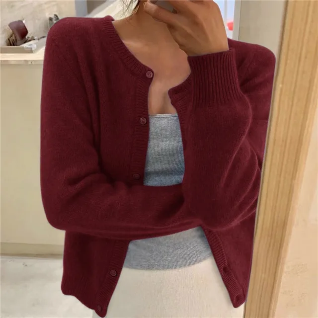 Women's solid color knit cardigan, soft breathable fabric, stylish minimalist design, versatile wardrobe essential.
