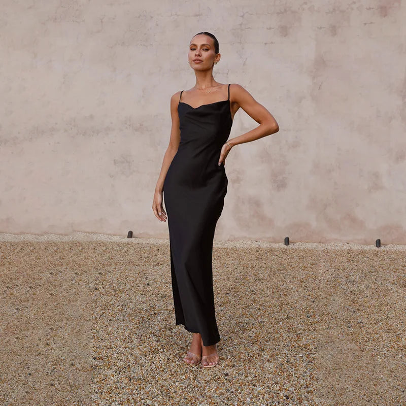 Women's spaghetti strap draped maxi dress, floor-length, fluid neckline, flattering silhouette, ideal for formal events.