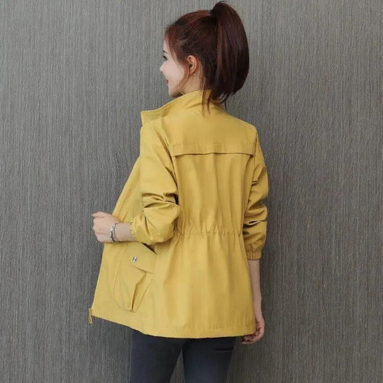Women's spring trench coat, khaki, mid-length, with adjustable waist and button-down closure, perfect for breezy days.