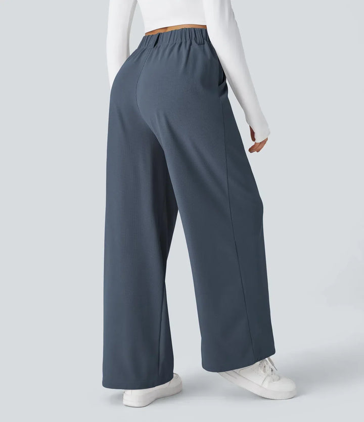 Women's stretch trousers, black, smooth fabric, tailored fit, flexible style, ideal for casual to formal outfits.