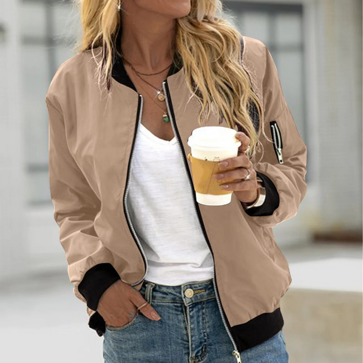 Women's stylish bomber jacket with zip, polyester blend, ribbed collar, versatile fit, available in multiple sizes.