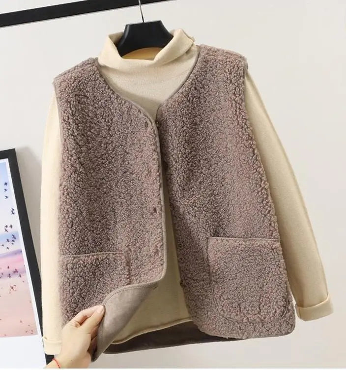 "Women's stylish fleece vest, front view, showing textured design, sleeveless, perfect for winter warmth and elegant style."