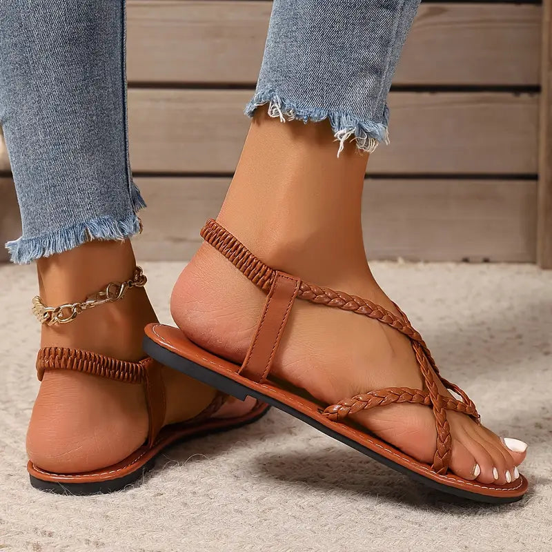 "Women's stylish slip-on sandals with ergonomic footbed, minimalist design, adjustable straps, and durable materials."