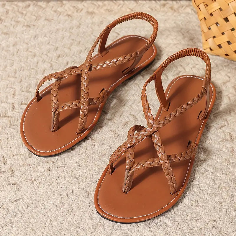 "Women's stylish slip-on sandals with ergonomic footbed, minimalist design, adjustable straps, and durable materials."