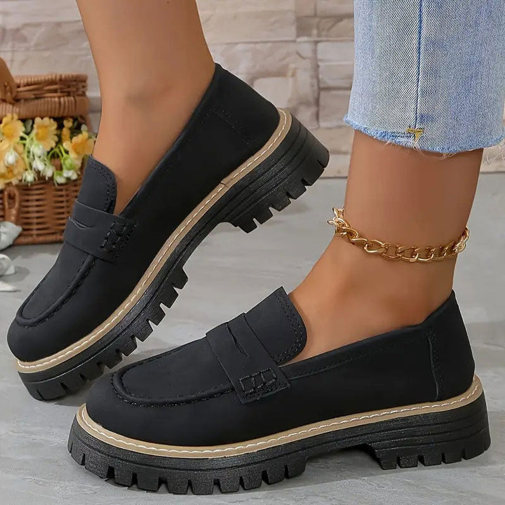 "Women's suede loafers with chunky sole and vamp strap, featuring rounded toe and premium suede for casual elegance."