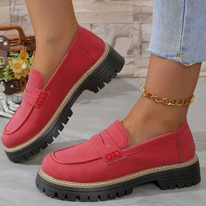 "Women's suede loafers with chunky sole and vamp strap, featuring rounded toe and premium suede for casual elegance."
