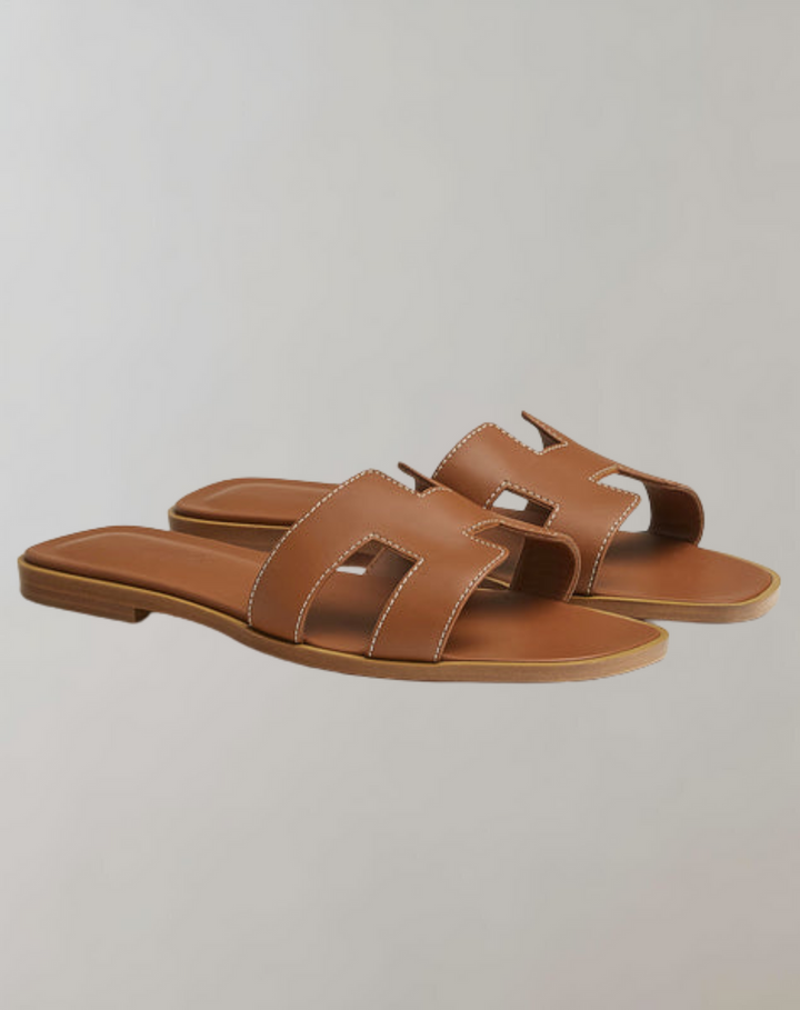 "Women's summer slippers, lightweight ergonomic design, breathable materials, durable anti-slip sole, casual style footwear."