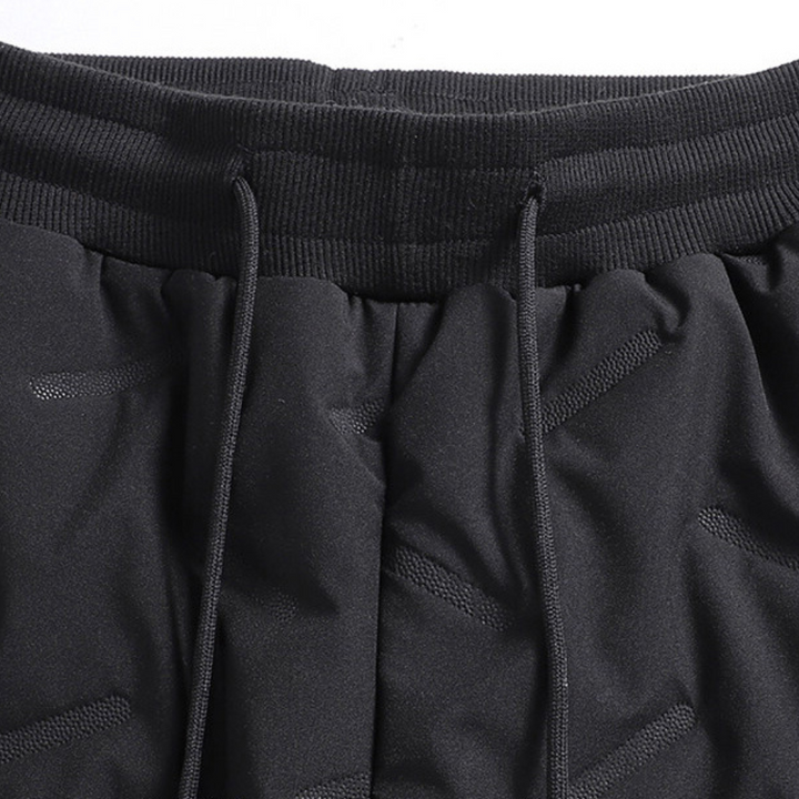 Women's thermal waterproof fleece-lined trousers, black, fleece interior, zippered pockets, ideal winter outdoor wear.