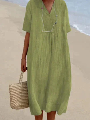 Women's V-Neck Relaxed Midi Dress in light, breathable fabric, featuring a flattering silhouette and perfect for warm weather