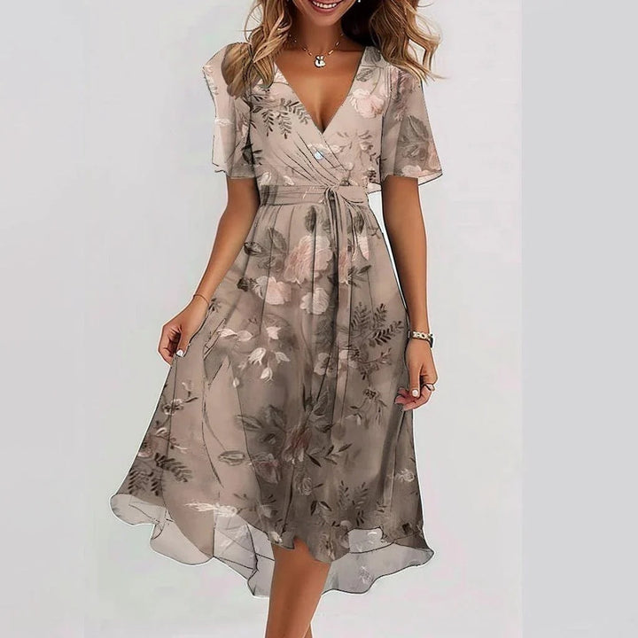 Women's V-neck wrap dress with flutter sleeves, cinched waist, and A-line silhouette in pastel hues; perfect for any occasion