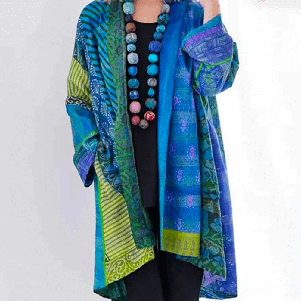"Women's vibrant cardigan, modern-vintage style, colorful patterns, silky fabric, classic and modern fusion, front view."