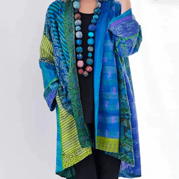 "Women's vibrant cardigan, modern-vintage style, colorful patterns, silky fabric, classic and modern fusion, front view."